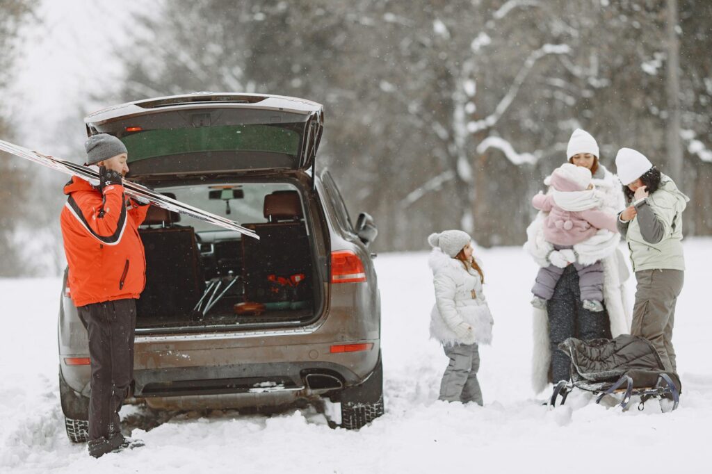 A family preparing their vehicle for a holiday road trip in Las Vegas. — road trip towing Las Vegas holidays