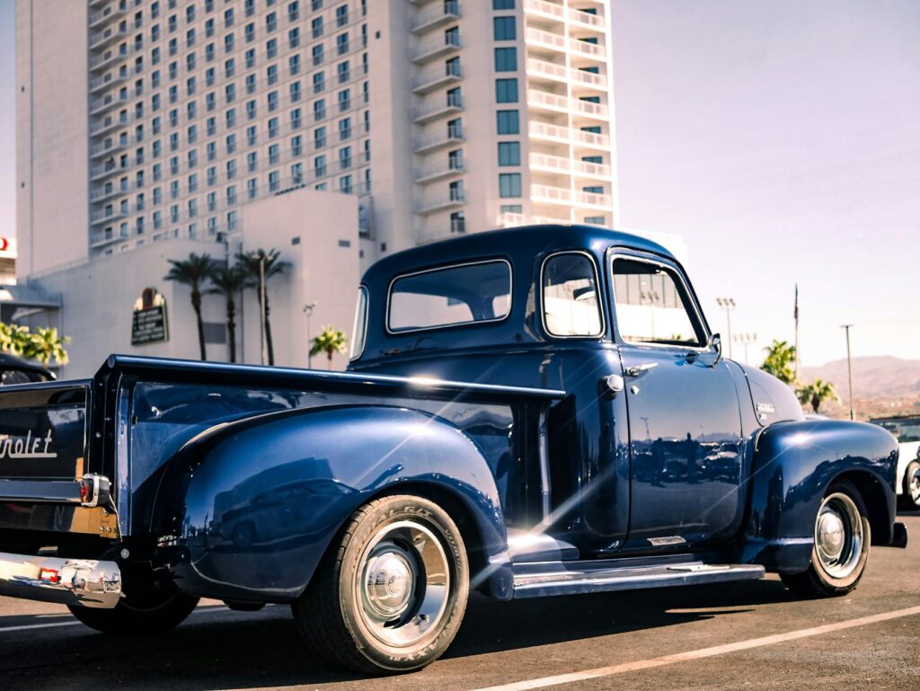 A tow truck parked in front of a Las Vegas landmark — reliable cheap towing Las Vegas