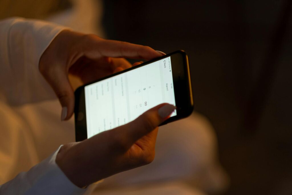 Photo of a person using an app to compare towing services. — save money towing Las Vegas
