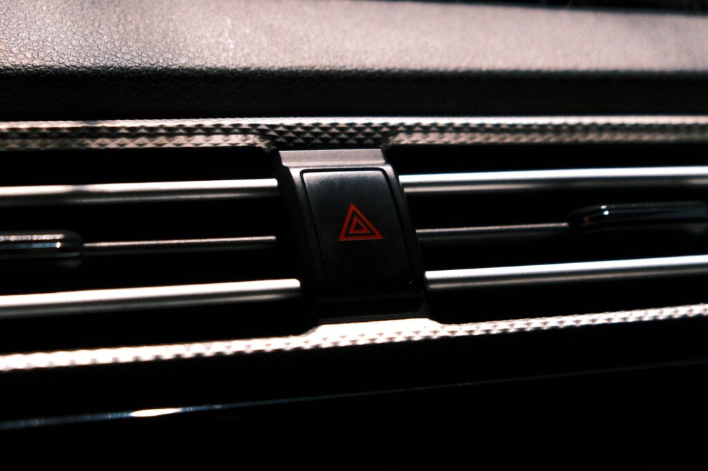 A car dashboard showing an overheating warning light. — car overheating las vegas