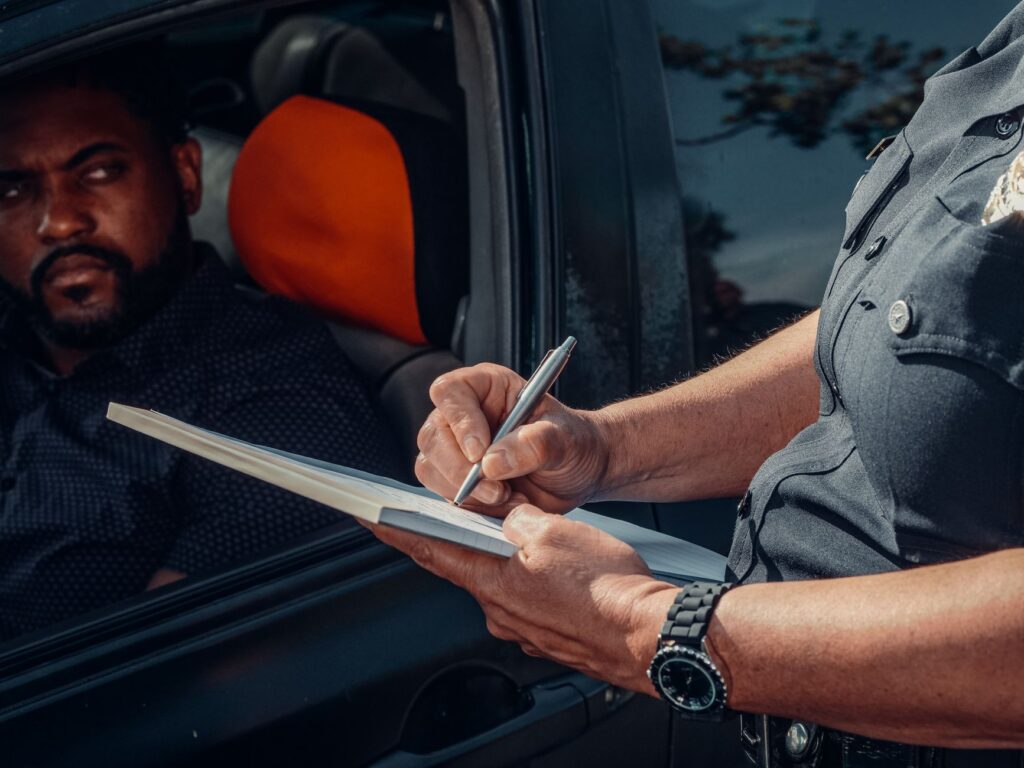 A car pulled over on the side of a Las Vegas highway with the driver assessing the situation. — car breakdown las vegas