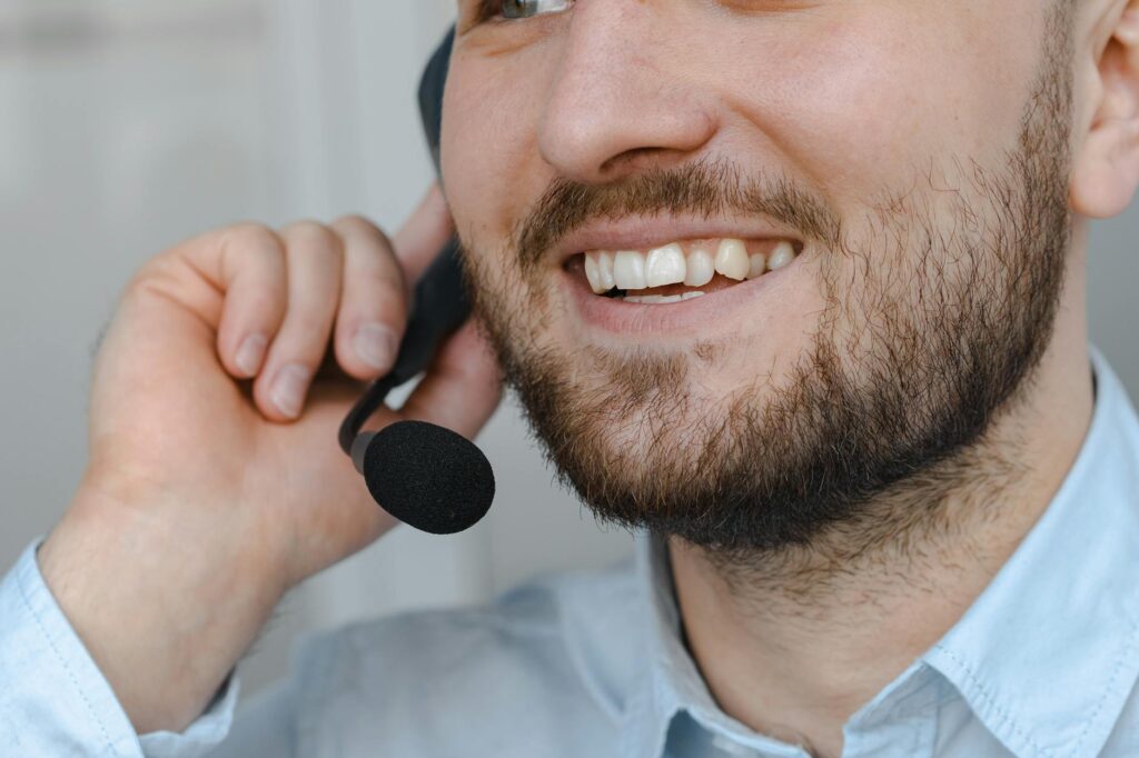 A close-up of a customer speaking with a towing service representative on the phone. — cheap towing Las Vegas