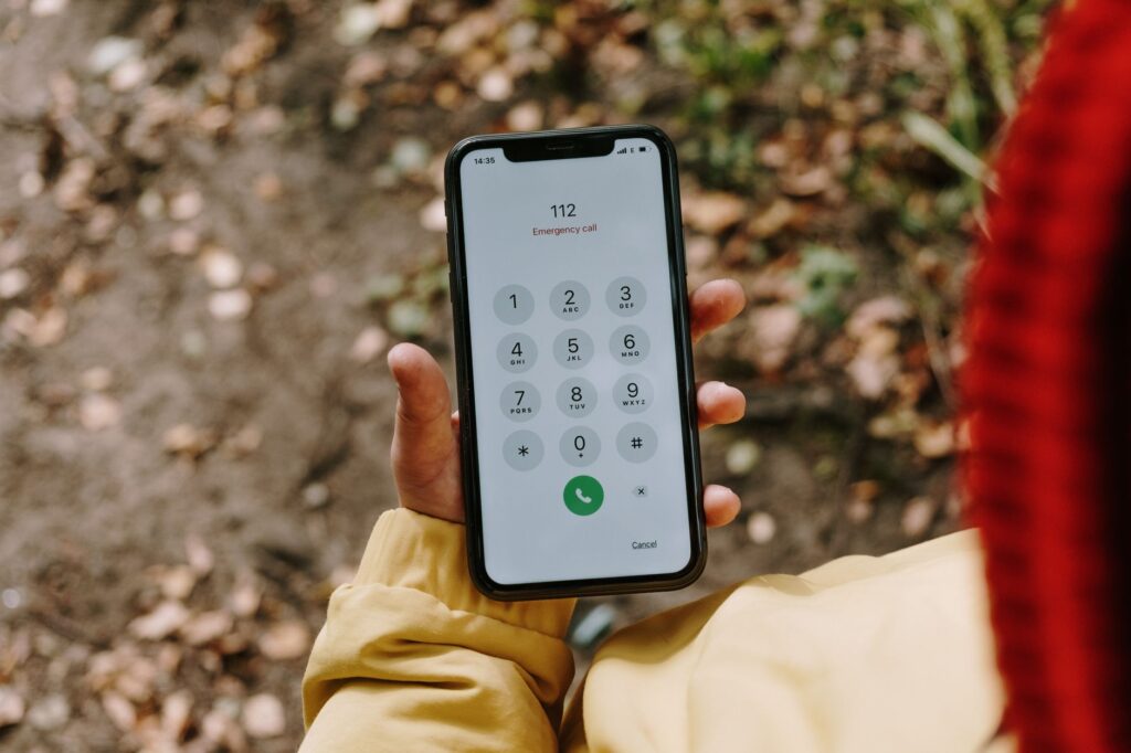 A close-up of a towing service's contact information on a smartphone. — emergency towing Las Vegas