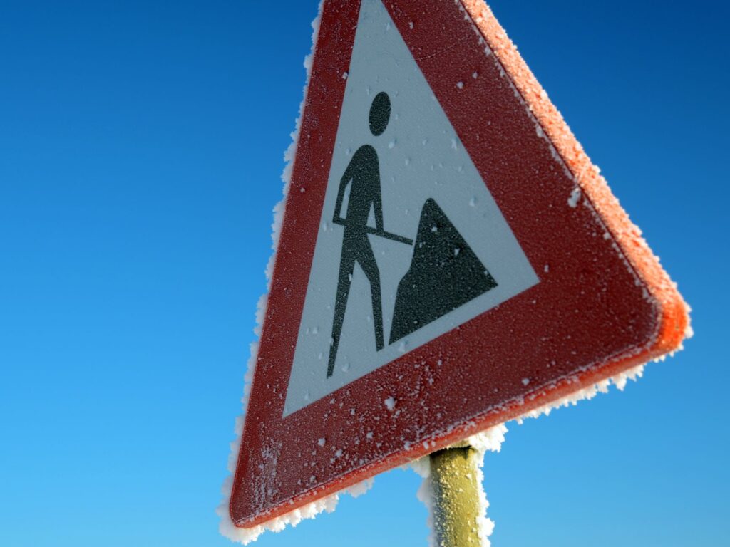 A close-up of a warning sign indicating a hazardous road condition. — las vegas road safety
