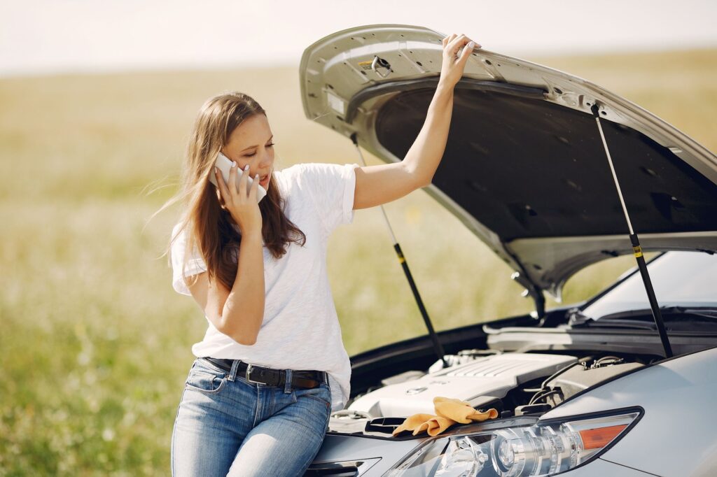 A driver safely waiting next to their vehicle after a breakdown — emergency towing Las Vegas