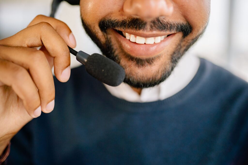 A friendly customer service representative talking to a client — choosing towing service Las Vegas
