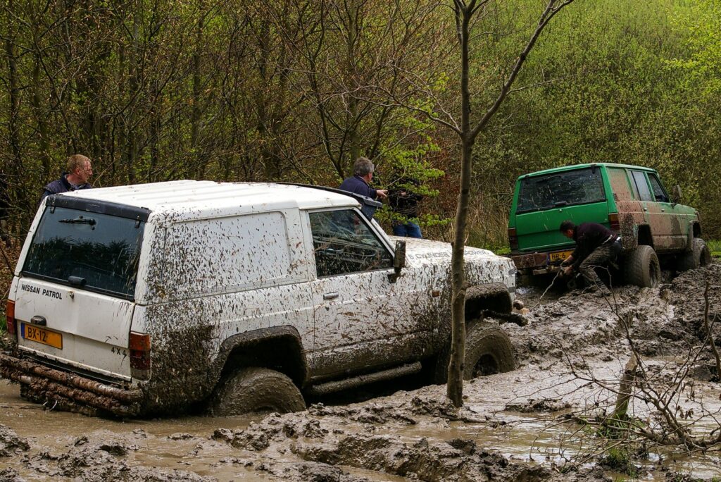 A professional tow driver evaluating a stuck vehicle — stuck car towing las vegas