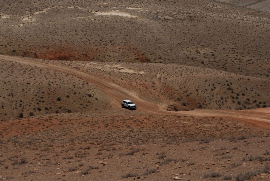 A rugged off-road vehicle navigating through a desert landscape. — off road towing las vegas