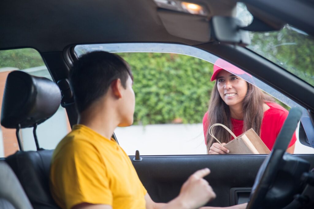 A smiling customer receiving their vehicle back from a towing service. — emergency towing Las Vegas