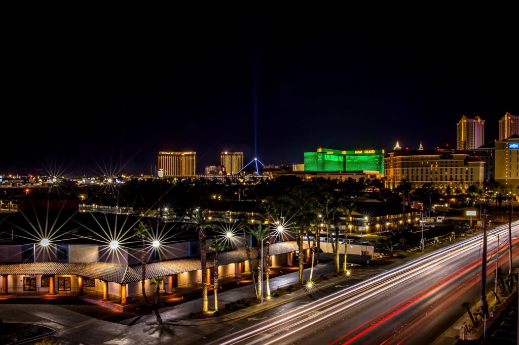 A tow truck on the Las Vegas Strip at night, showcasing the city lights. — emergency towing Las Vegas