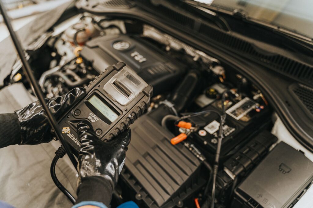 Image of a battery testing tool being used on a car battery. — dead battery las vegas