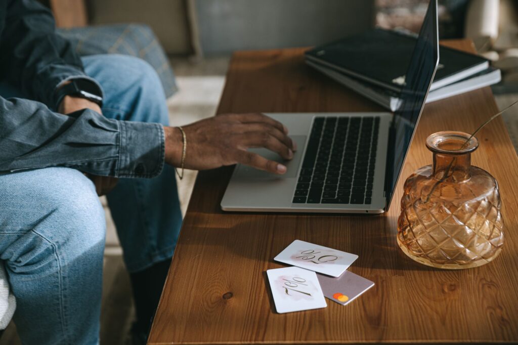 Image of a person looking at membership cards like AAA for towing discounts. — save money towing Las Vegas