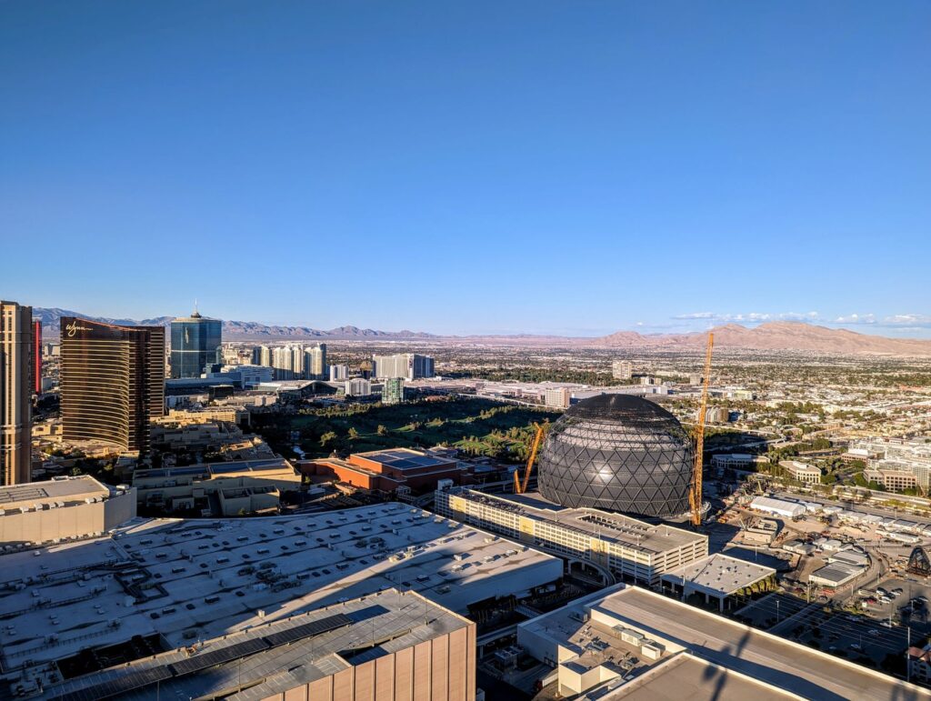 Image of a tow truck in Las Vegas with a clear view of the city skyline. — affordable towing services Las Vegas