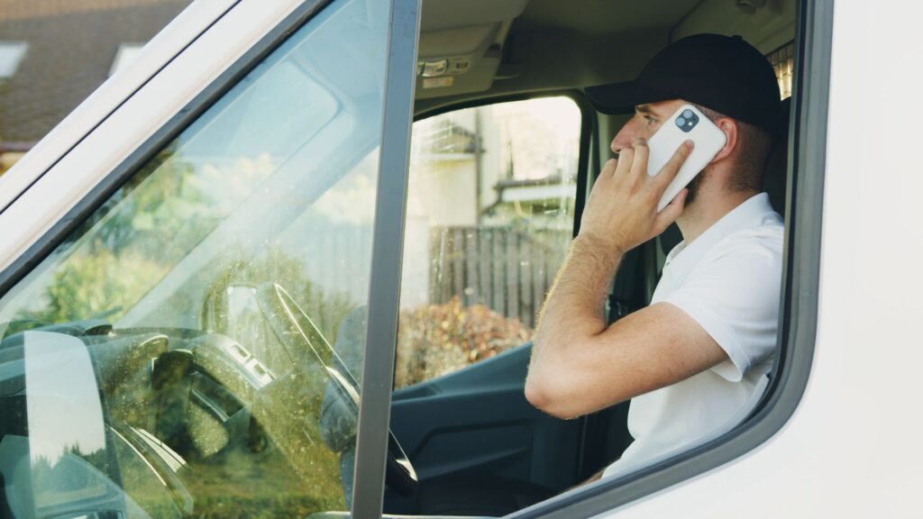 Photo of a driver on the phone calling for 24/7 towing in Las Vegas. — emergency towing Las Vegas
