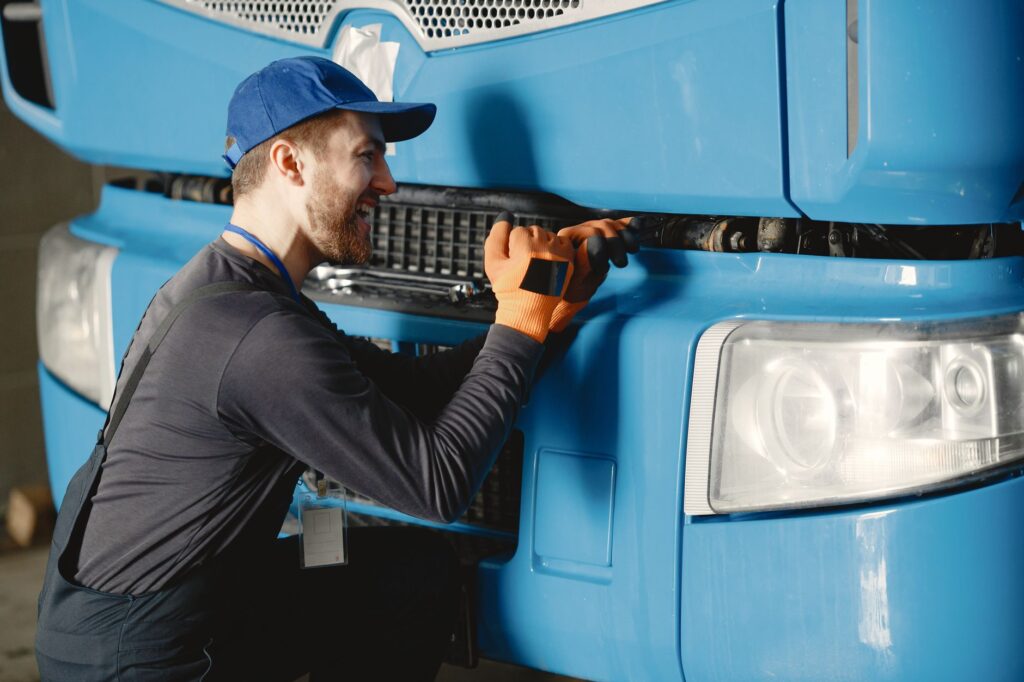 A mechanic inspecting a vehicle to represent common roadside assistance services. — emergency towing Las Vegas