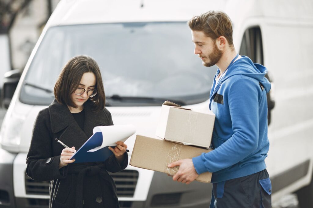 A satisfied customer receiving help from a towing professional next to their van. — suv tow truck las vegas