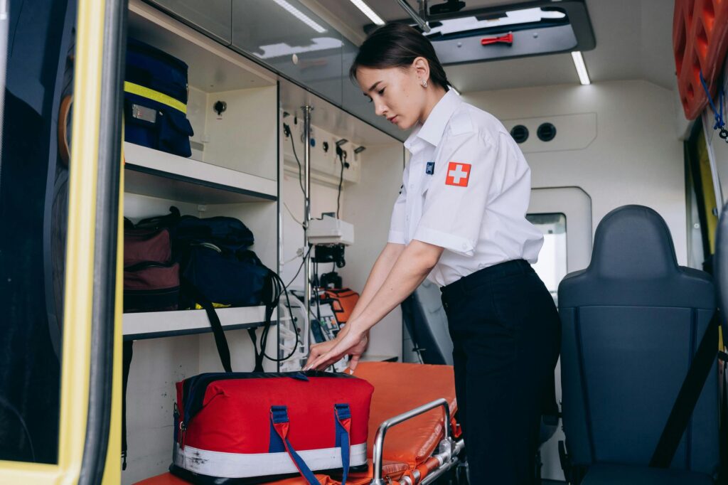 A well-organized emergency car kit displayed in a vehicle trunk.